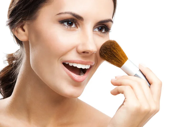 Young woman with cosmetics brush, isolated — Stock Photo, Image