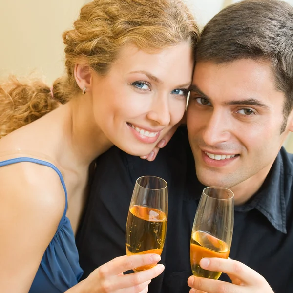 Cheerful couple with champagne — Stock Photo, Image