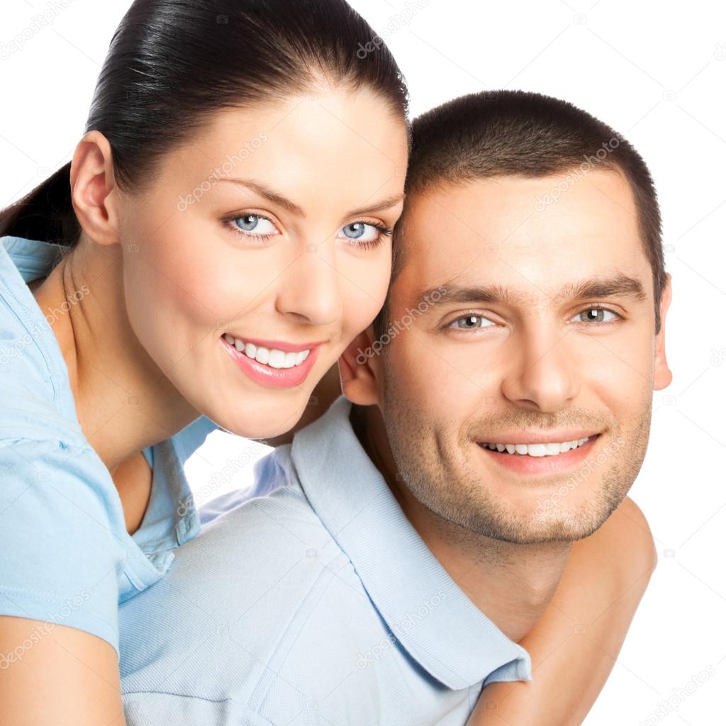 Portrait of young happy smiling attractive couple, isolated on w