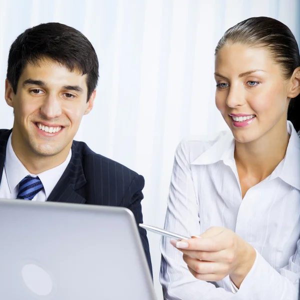 Businesspeople working at office Stock Image