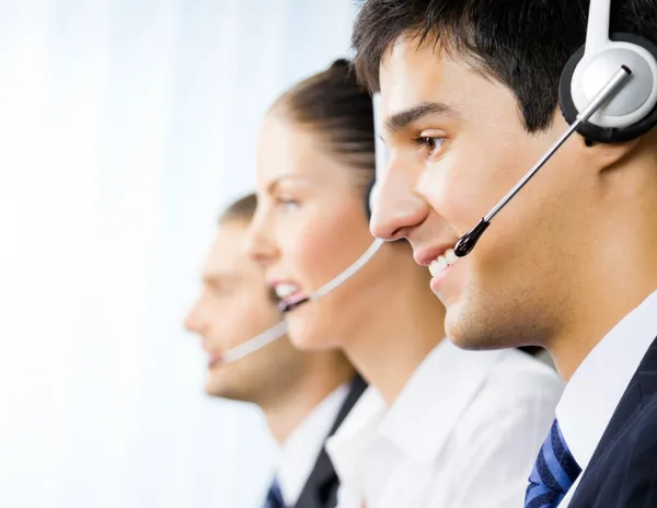 Three customer support phone operators — Stock Photo, Image