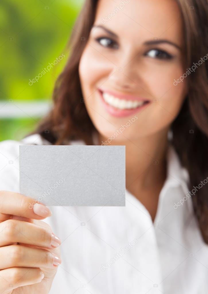 Businesswoman showing blank business card