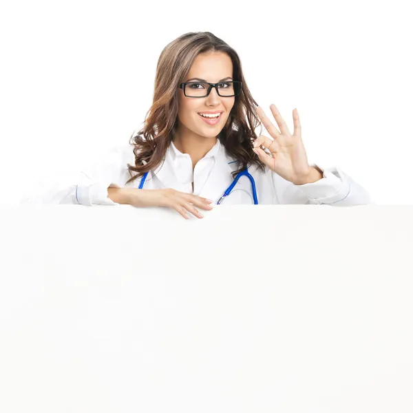 Doctor mostrando letrero en blanco, aislado — Foto de Stock