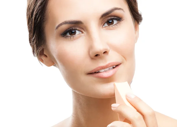 Young woman cleaning skin by cotton pad, over blue — Stock Photo, Image