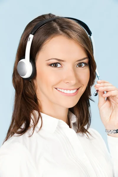 Obsługa telefonu operatora w słuchawki na głowę, na niebiesko — Zdjęcie stockowe