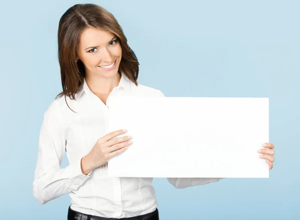 Businesswoman showing signboard, over blue Stock Image