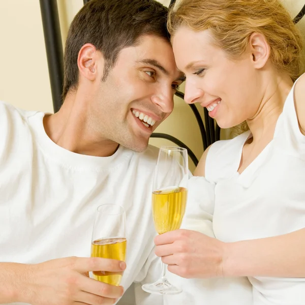 Cheerful couple with champagne — Stock Photo, Image
