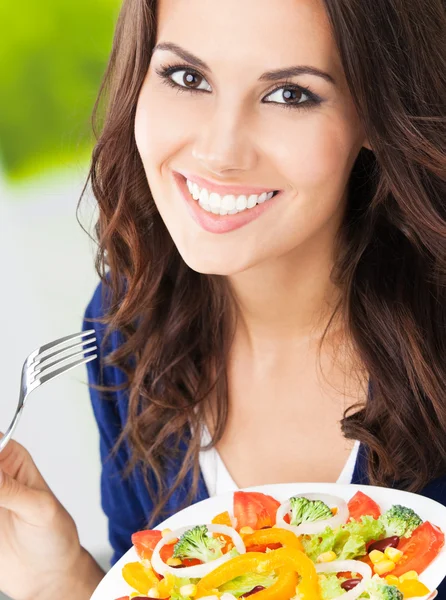 Young woman with salad, outdoors Stock Image