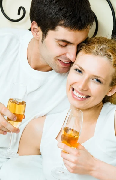 Cheerful couple with champagne — Stock Photo, Image