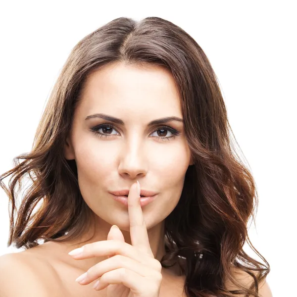 Frau mit Finger auf den Lippen, auf weiß — Stockfoto