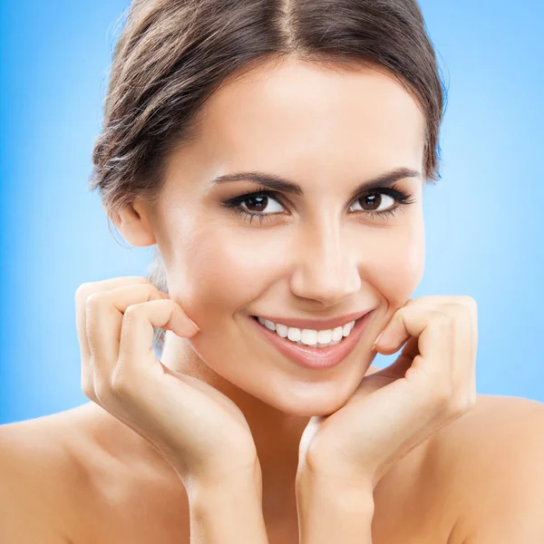 Portrait of beautiful woman, on blue — Stock Photo, Image