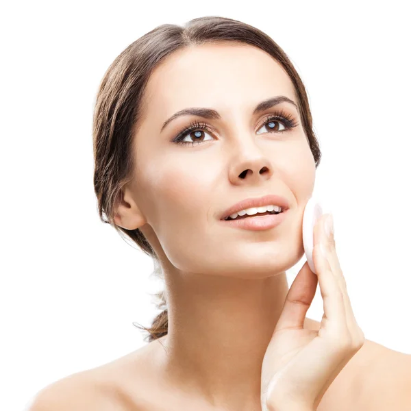 Young woman cleaning skin by cotton pad, over white — Stock Photo, Image