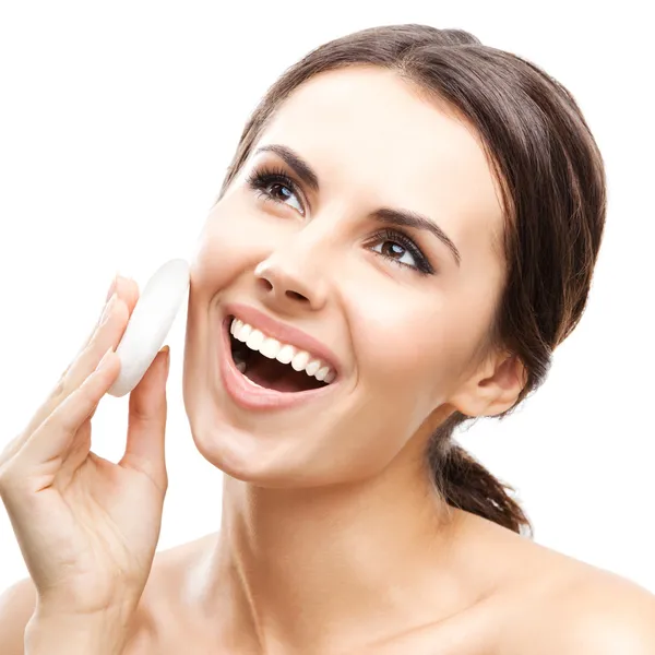 Young woman cleaning skin by cotton pad, over white — Stock Photo, Image