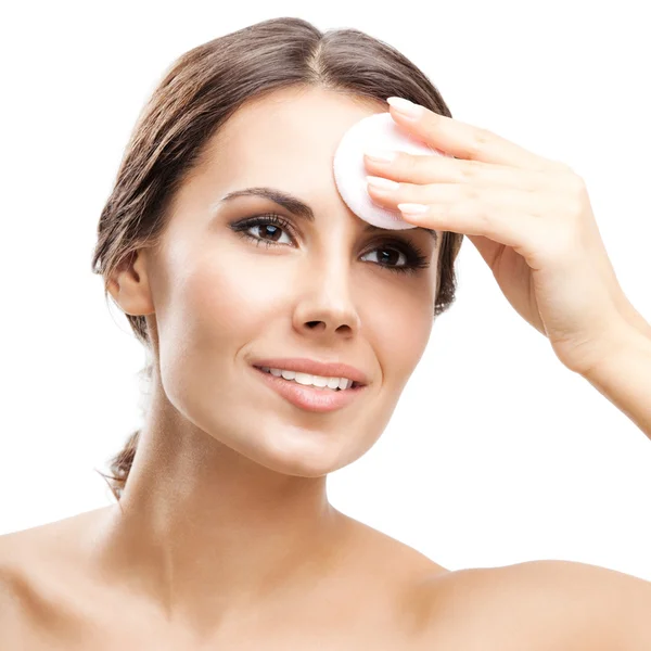 Young woman cleaning skin by cotton pad, over white — Stock Photo, Image