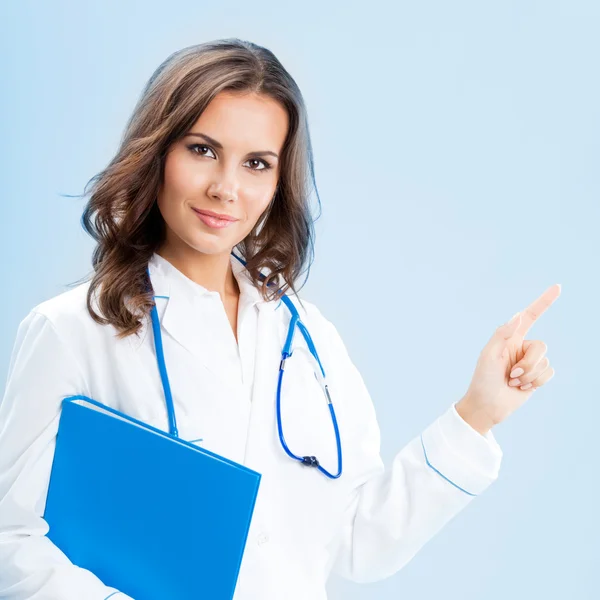 Showing doctor with folder, over blue Stock Image