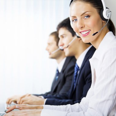 Three support phone operators at workplace clipart