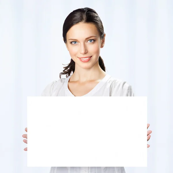 Businesswoman showing blank signboard, at office Royalty Free Stock Photos