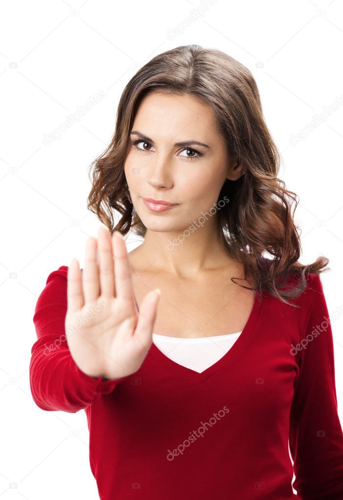 Serious woman with stop gesture, isolated