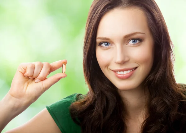 ⬇ Скачать картинки Женшина с капсулой, стоковые фото Женшина с капсулой в хорошем качестве | Depositphotos