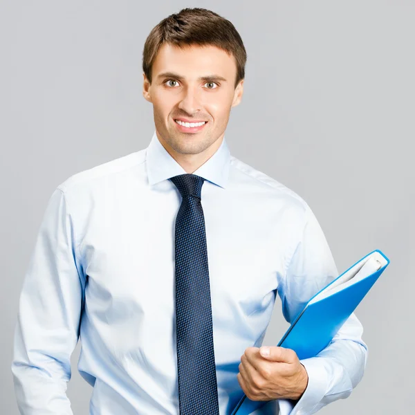 Business man with folder, on gray — Stock Photo, Image