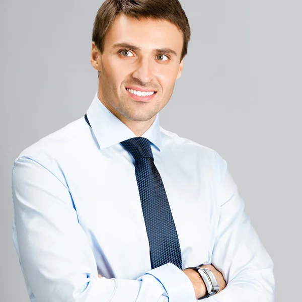 Portrait of business man, over gray background — Stock Photo, Image