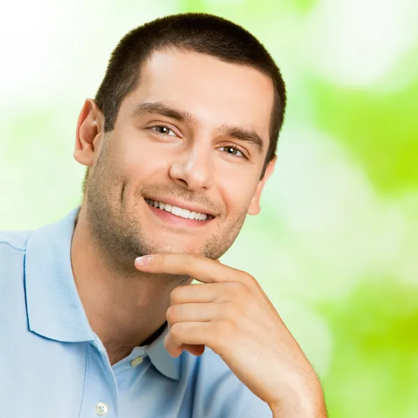 Portrait of young attractive smiling man, outdoor — Stock Photo, Image