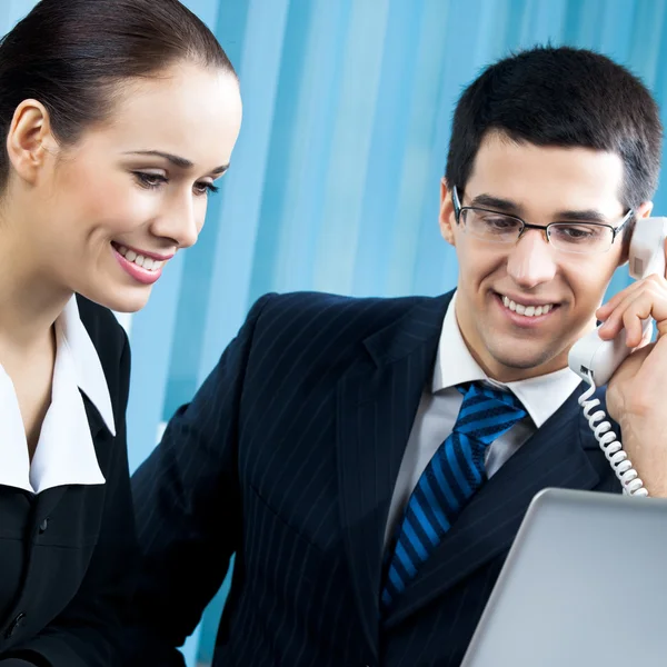 Two happy businesspeople working at office — Stock Photo, Image