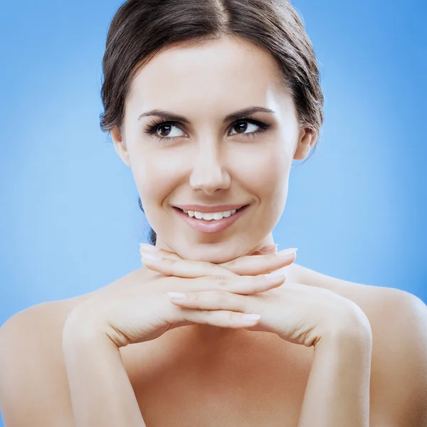 Portrait of beautiful woman, on blue — Stock Photo, Image