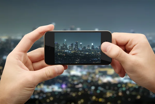 Man photographs night city — Stock Photo, Image