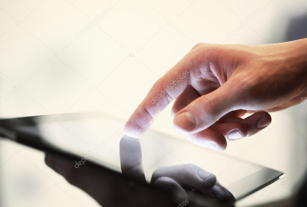 hand touching tablet
