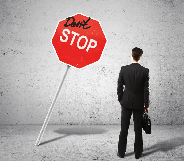 Businessman and stop sign — Stock Photo, Image