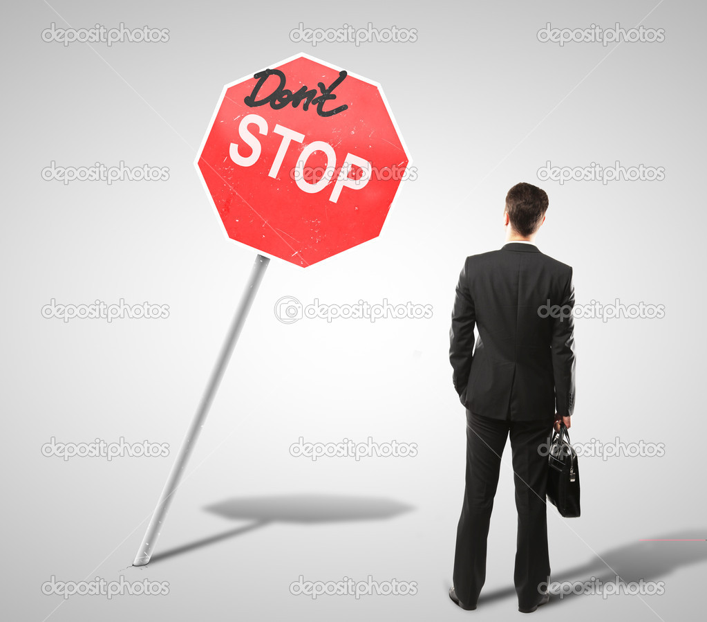 man and stop sign
