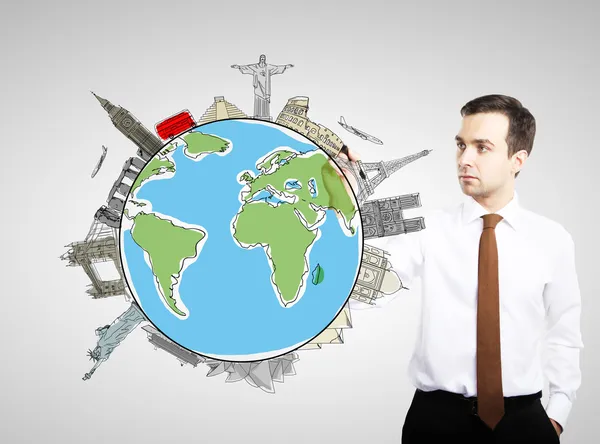 Businnesman drawing colorized earth — Stock Photo, Image