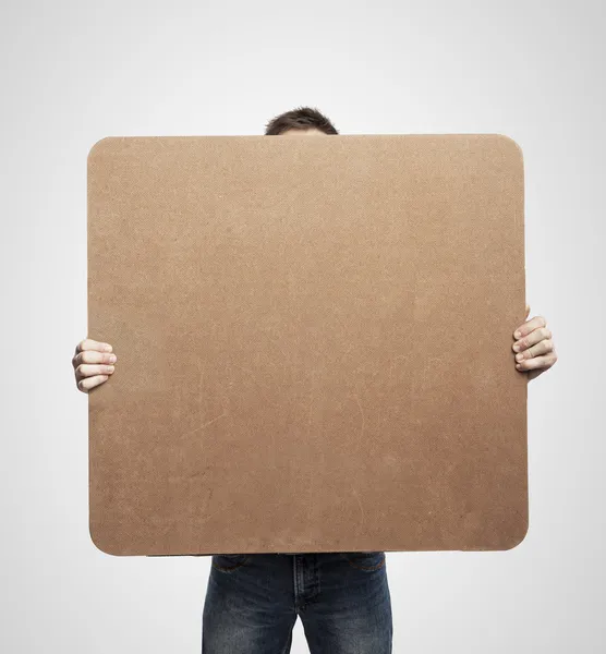 Man holding poster — Stock Photo, Image