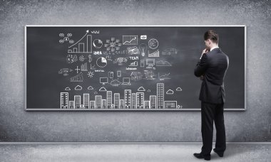 man looking at business strategy