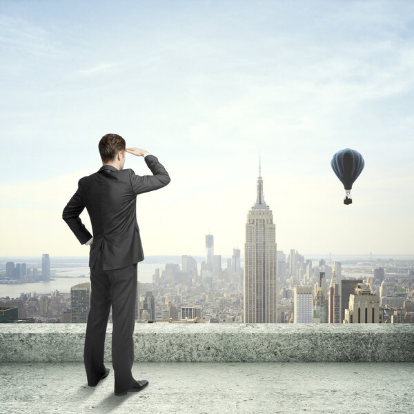 Businessman looking at city