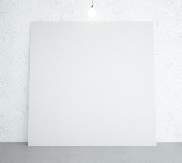 White poster in room with ceiling lamp