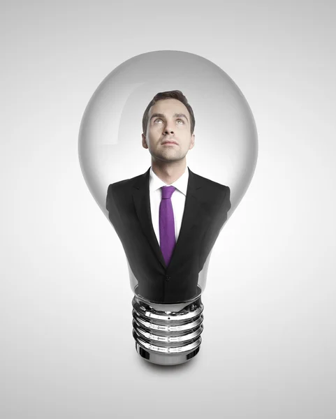 Businessman in lamp — Stock Photo, Image