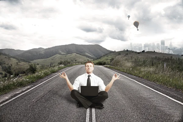 Businessman meditatingon — Stock Photo, Image