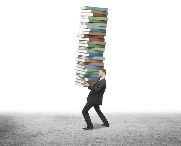 Businessman holding books — Stock Photo, Image
