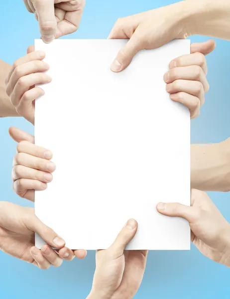 Many hands holding poster — Stock Photo, Image