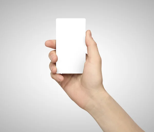 Hand som håller papper telefon — Stockfoto