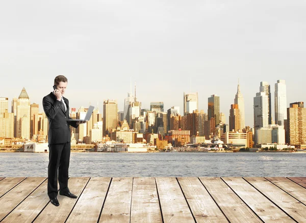 Businessman standing on pier — Stock Photo, Image