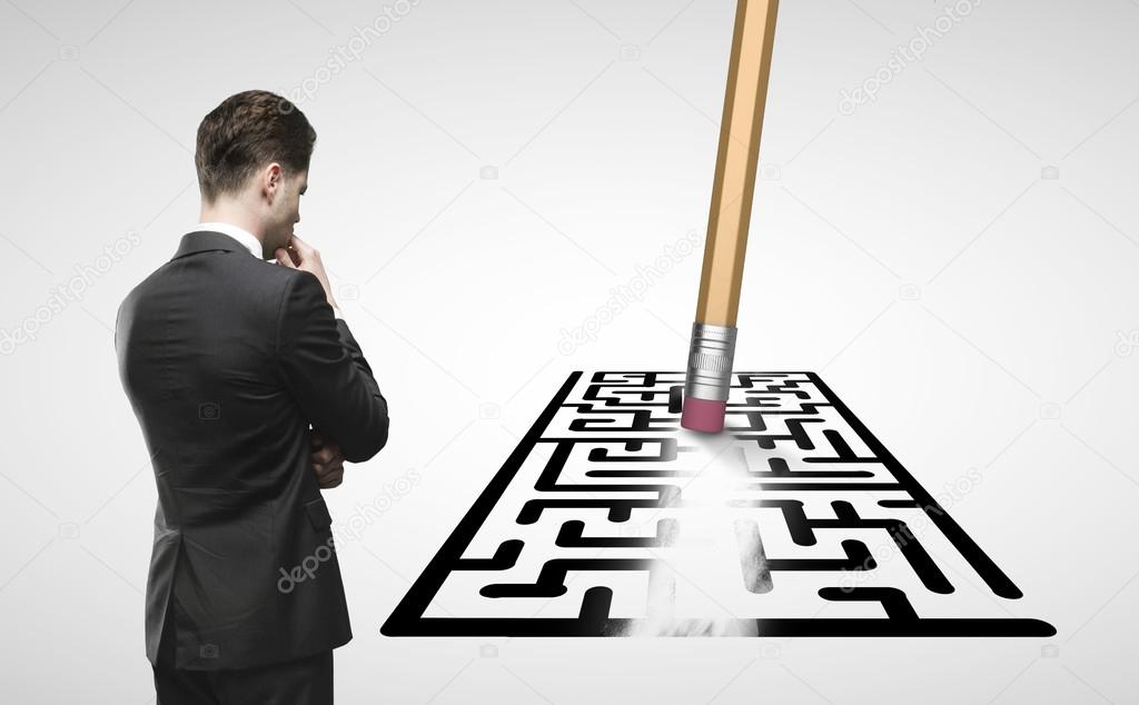 businessman looking at maze