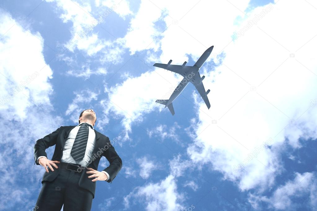 man looking on airplane