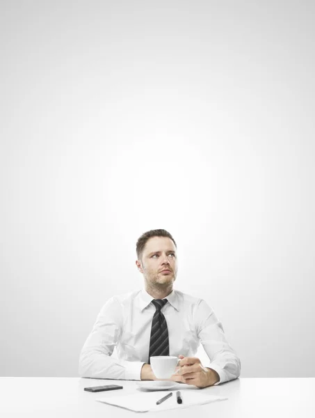 Man sitting on table — Stock Photo, Image