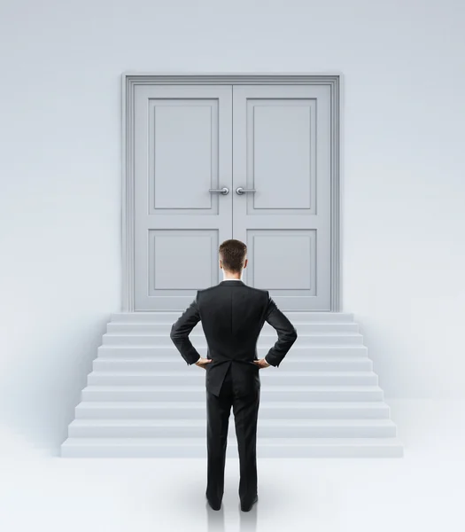 Businessman and doors — Stock Photo, Image