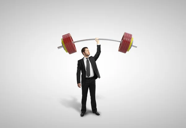 Man bedrijf barbell — Stockfoto