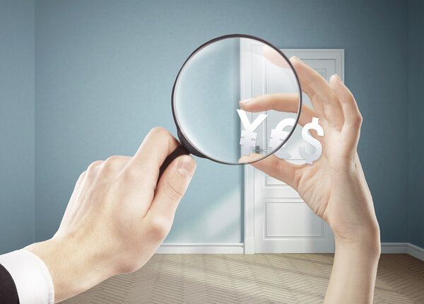 hand holding magnifying glass