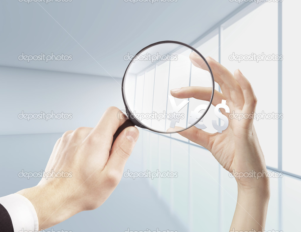 magnifying glassin hand